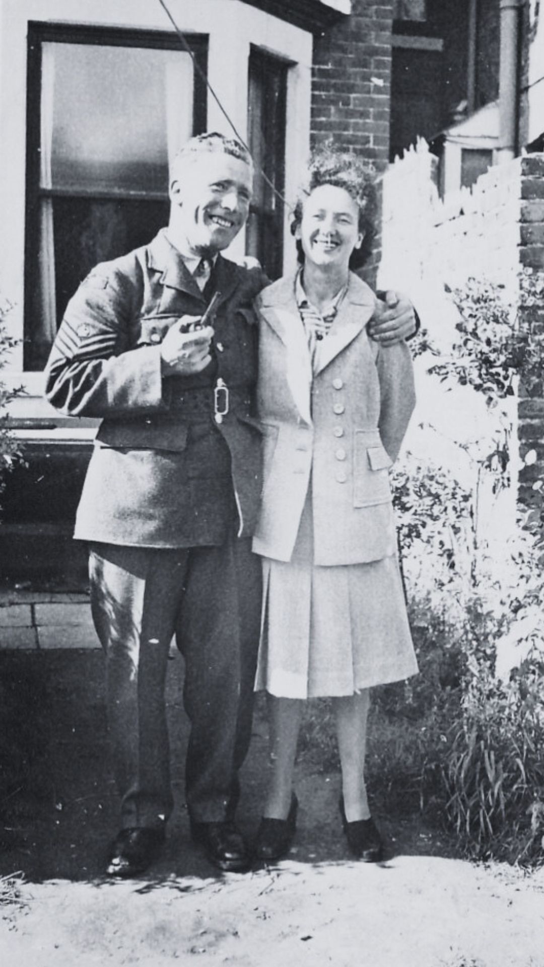 Warrant Officer Henry Higgins of No. 968 Barrage Ballon Squadron and his wife Teresa Higgins (née Bradley) at their home possibly in London, England in 1946.