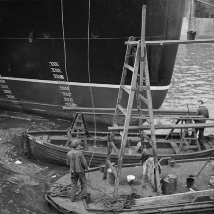 Workers in Glasgow, Lanarkshire, Scotland painting the stern of S.S. Athenia. Photo taken by Paul Vanderbilt during the summer of 1937.