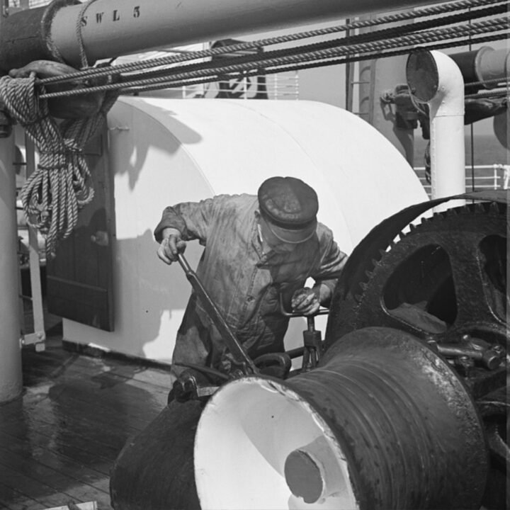 A machinist working on a winch on board S.S. Athenia. Photo taken by Paul Vanderbilt during the summer of 1937.