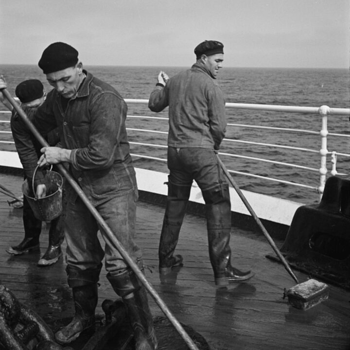 Seamen sanding the deck on board S.S. Athenia. Photo taken by Paul Vanderbilt during the spring of 1937.